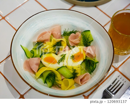 Salad with ham, cheese and boiled egg 120693137