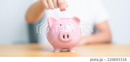 Money Saving for Future Plan, Retirement fund, Pension, Investment, Wealth Business and Financial concepts. hand holding and putting into piggy bank, Money Counting for World Savings day and Donate Money Saving for Future Plan, Retirement fund, Pension, Investment, Wealth Business and Financial concepts. hand holding and putting into piggy bank, Money Counting for World Savings day and Donate 120693316