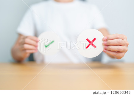 Woman show Wrong symbol paper. True and false, accept and rejected, evaluation, Vote, Poll, Yes or No and Survey concepts 120693343