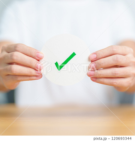 Woman show Right symbol paper. True and false, accept and rejected, evaluation, Vote, Poll, Yes or No and Survey concepts 120693344