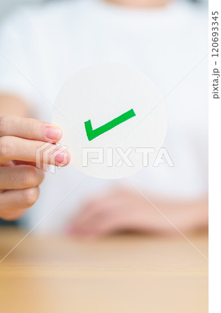 Woman show Right symbol paper. True and false, accept and rejected, evaluation, Vote, Poll, Yes or No and Survey concepts 120693345