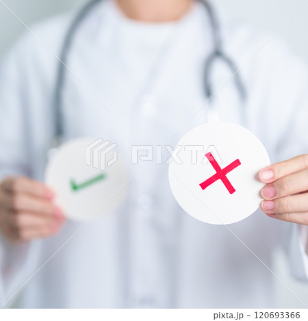 Doctor show Wrong symbol paper. True and false, accept and rejected, evaluation, Diagnosis, Vote, Poll, Yes or No, Health, Medical and Survey concepts 120693366