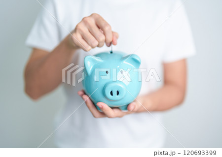 Money Saving for Future Plan, Retirement fund, Pension, Investment, Wealth Business and Financial concepts. hand holding and putting into piggy bank, Money Counting for World Savings day and Donate Money Saving for Future Plan, Retirement fund, Pension, Investment, Wealth Business and Financial concepts. hand holding and putting into piggy bank, Money Counting for World Savings day and Donate 120693399
