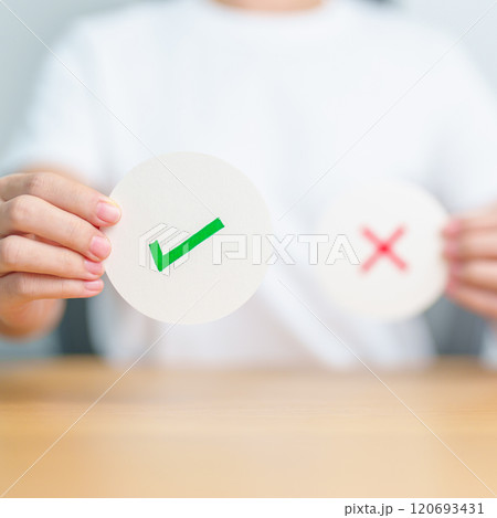 Woman show Right symbol paper. True and false, accept and rejected, evaluation, Vote, Poll, Yes or No and Survey concepts Woman show Right symbol paper. True and false, accept and rejected, evaluation, Vote, Poll, Yes or No and Survey concepts 120693431