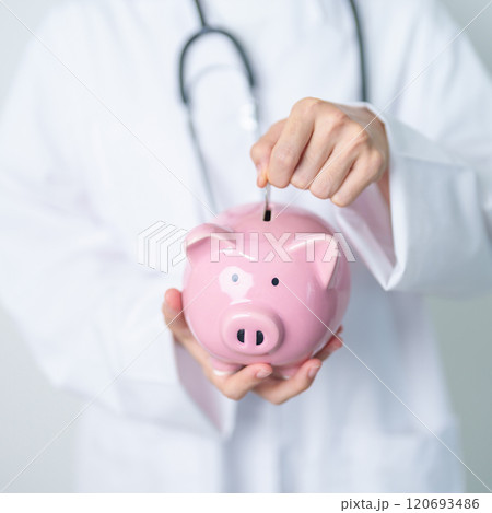 Doctor holding piggy bank and putting coin. and Healthcare cost, Money Saving, Health Insurance, Medical, Donation and Financial concepts Doctor holding piggy bank and putting coin. and Healthcare cost, Money Saving, Health Insurance, Medical, Donation and Financial concepts 120693486