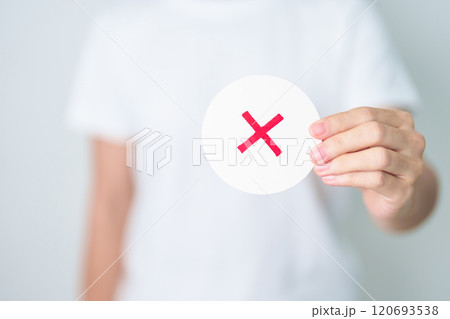 Woman show Wrong symbol paper. True and false, accept and rejected, evaluation, Vote, Poll, Yes or No and Survey concepts Woman show Wrong symbol paper. True and false, accept and rejected, evaluation, Vote, Poll, Yes or No and Survey concepts 120693538