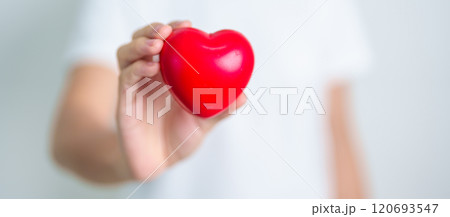hand holding red heart shape in hospital. love, donor, world heart day, world health day, CSR donation and Insurance concepts 120693547