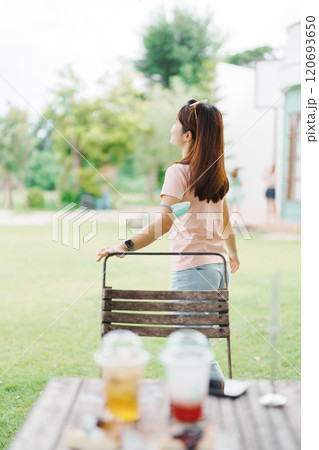 Happy woman with Dessert in cafe, young Asian girl smiling during eating cake and drinking ice beverage at home Happy woman with Dessert in cafe, young Asian girl smiling during eating cake and drinking ice beverage at home 120693650