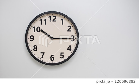 Classic Black-Edged Clock on White Background at 10.15/22.15 - Perfect for Time Management and Text Space Classic Black-Edged Clock on White Background at 10.15/22.15 - Perfect for Time Management and Text Space 120696882