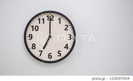 Classic Black-Edged Clock on White Background at 19.00/07.00 - Perfect for Time Management and Text Space 120697094