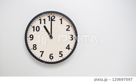Classic Black-Edged Clock on White Background at 11.00/23.00 - Perfect for Time Management and Text Space 120697097