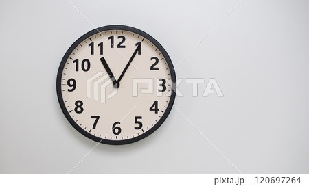 Classic Black-Edged Clock on White Background at 23.05/11.05 - Perfect for Time Management and Text Space 120697264