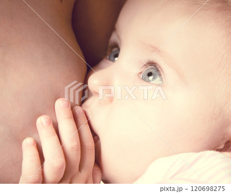 little baby sucking breast mother with open eyes little baby sucking breast mother with open eyes 120698275