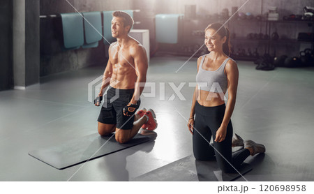 Dynamic Fitness Partners Enthusiastically Engaging in an Energizing Workout Session Together Dynamic Fitness Partners Enthusiastically Engaging in an Energizing Workout Session Together 120698958