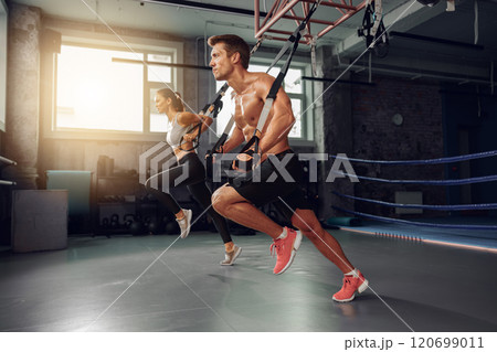 Experience Dynamic Fitness Training in the Gym with TRX Suspension Straps for all levels Experience Dynamic Fitness Training in the Gym with TRX Suspension Straps for all levels 120699011