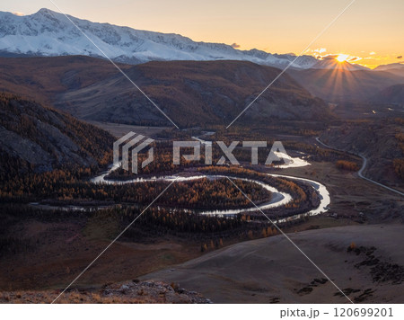 Twilight in a mountain valley with a twisty river. Twilight in a mountain valley with a twisty river. 120699201