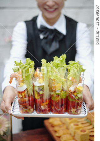 Presenting Colorful Fresh Shrimp Salad in Glass Cups 120699267
