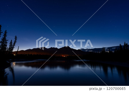 Pyramid Mountain silhouette reflected on Athabasca River at twilight time. Town Jasper at night. Alberta, Canada. 120700085
