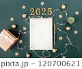 Horizontal green banner with white blank notepad numbers 2025. Concept of planning and setting goals for future. Atmosphere of New Years holiday 120700621