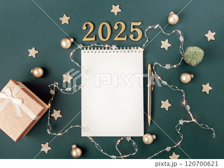 Horizontal green banner with white blank notepad numbers 2025. Concept of planning and setting goals for future. Atmosphere of New Years holiday Horizontal green banner with white blank notepad numbers 2025. Concept of planning and setting goals for future. Atmosphere of New Years holiday 120700621