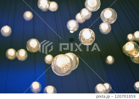 Chandelier in the lobby in the form of many hanging white balls 120701859