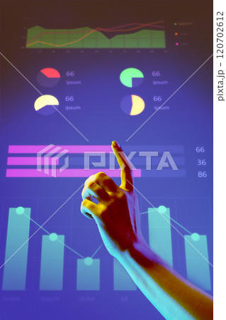 Hand pointing to dynamic and colorful graphs on futuristic digital screen. Represents data insights, financial analysis, and progress tracking. Hand pointing to dynamic and colorful graphs on futuristic digital screen. Represents data insights, financial analysis, and progress tracking. 120702612