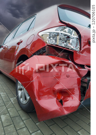 Dramatic View of Damaged Red Car After Accident 120706105