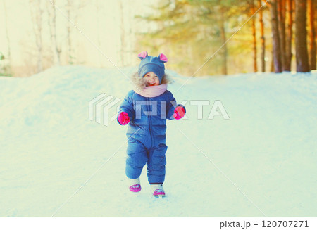 Winter happy smiling child having fun on snow Winter happy smiling child having fun on snow 120707271
