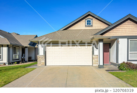 Wide garage of a nice residential house on bright winter day in British Columbia, Canada Wide garage of a nice residential house on bright winter day in British Columbia, Canada 120708319
