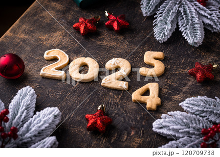 Festive New Year cookies in shape of 2025 Festive New Year cookies in shape of 2025 120709738