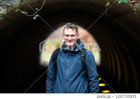 Outdoor portrait of a 45 yo white hiking man in an autumn forest in Oud Heverlee, Belgium 120710935