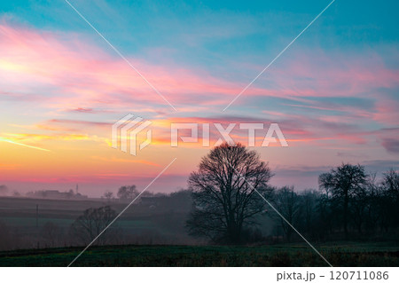 sunset in the field. beautiful autumn foggy landscape in Ukraine 120711086