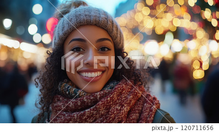Warm smile in festive urban winter setting - perfect for holiday campaigns 120711656