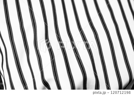 Black and white striped textile showcasing a modern design in fabric art Black and white striped textile showcasing a modern design in fabric art 120712198