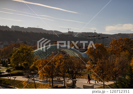 Vibrant colors of autumn transform Tbilisis skyline with stunning architecture and golden foliage 120712351