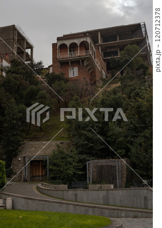 Charming autumn hues paint the lush hills of Tbilisi, revealing architectural beauty and natures embrace 120712378