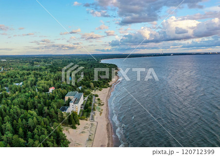 A serene coast with sandy beach and lush greenery under a beautiful sky in northern landscape A serene coast with sandy beach and lush greenery under a beautiful sky in northern landscape 120712399