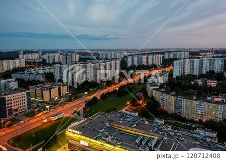 A vibrant cityscape at dusk showcasing urban life and illuminated buildings in a bustling metropolis 120712408