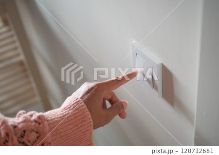 Turning On a Light Switch A Small Yet Significant Moment in Home Interior Design and Lifestyle 120712681