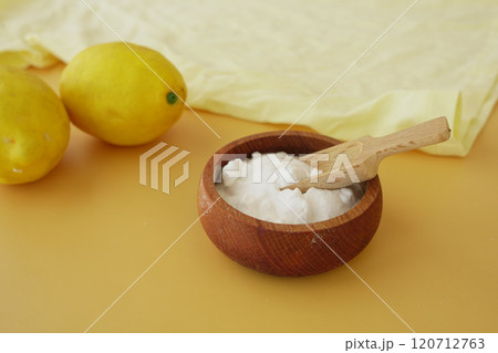 Baking soda and whole lemon on table Baking soda and whole lemon on table 120712763