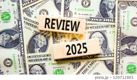 Planning review 2025 new year symbol. Concept words Review 2025 on beautiful wooden blocks. Dollar bills. Beautiful background from dollar bills. Business review 2025 new year concept. Copy space. 120712801