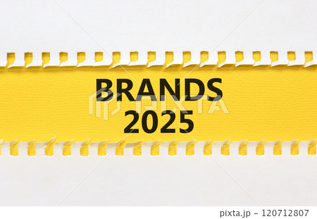 Planning brands 2025 new year symbol. Concept words Brands 2025 on beautiful yellow paper. Beautiful white background. Business brands 2025 new year concept. Copy space. Planning brands 2025 new year symbol. Concept words Brands 2025 on beautiful yellow paper. Beautiful white background. Business brands 2025 new year concept. Copy space. 120712807