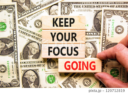 Keep your focus going symbol. Concept words Keep your focus going on beautiful wooden blocks. Dollar bills. Beautiful background from dollar bills. Business keep your focus going concept. Copy space. Keep your focus going symbol. Concept words Keep your focus going on beautiful wooden blocks. Dollar bills. Beautiful background from dollar bills. Business keep your focus going concept. Copy space. 120712819