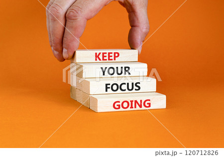 Keep your focus going symbol. Concept words Keep your focus going on beautiful wooden blocks. Beautiful orange table orange background. Business and keep your focus going concept. Copy space. Keep your focus going symbol. Concept words Keep your focus going on beautiful wooden blocks. Beautiful orange table orange background. Business and keep your focus going concept. Copy space. 120712826