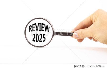 Planning review 2025 new year symbol. Concept words Review 2025 on beautiful white paper in magnifying glass. Beautiful white paper background. Business review 2025 new year concept. Copy space. 120712867