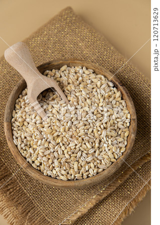 Raw pearl barley porridge Gluten free cereals. Health gut benefits. Concept of alternative whole spelt grain ingredient. Vegetarian diet recipes. Plant-based lifestyle. Copy space Protein rich 120713629