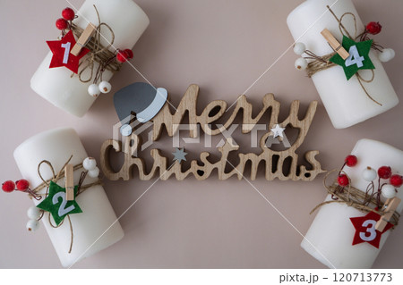 Merry Christmas wooden message Four Advent candles calendar with Christmas zero waste decorations. Holiday preparation copy space for text. Catholic traditions of Christmas countdown new year winter 120713773