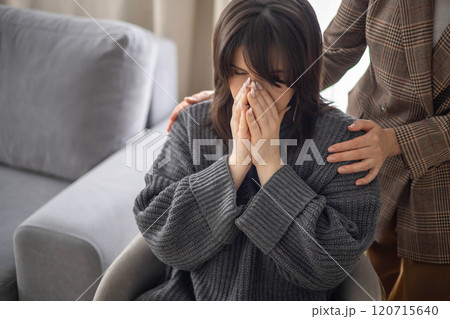 Sad woman crying at psychologist session female specialist help aid mental assistance closeup Sad woman crying at psychologist session female specialist help aid mental assistance closeup 120715640