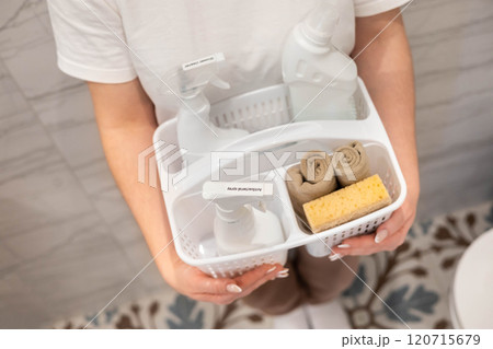 Portrait woman housewife plastic container bathroom chemical cleaner detergent storage organizing Portrait woman housewife plastic container bathroom chemical cleaner detergent storage organizing 120715679