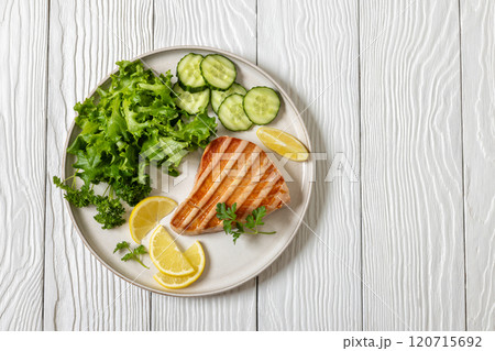 grilled tuna steak on a plate, top view 120715692